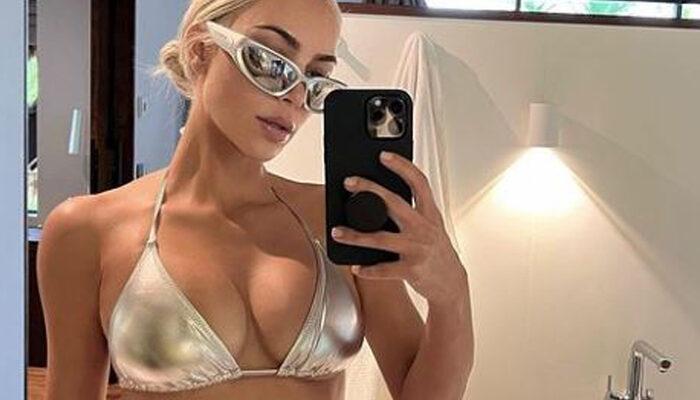 Kim Kardashian beyaz bikinisiyle kıvrımlarını sergiledi